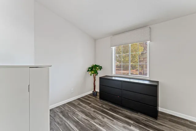 a room with a bed and a window