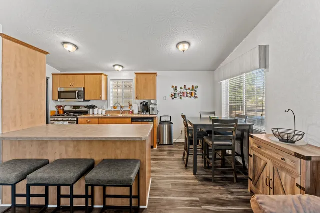 a kitchen with granite countertop lots of counter top space and dining table