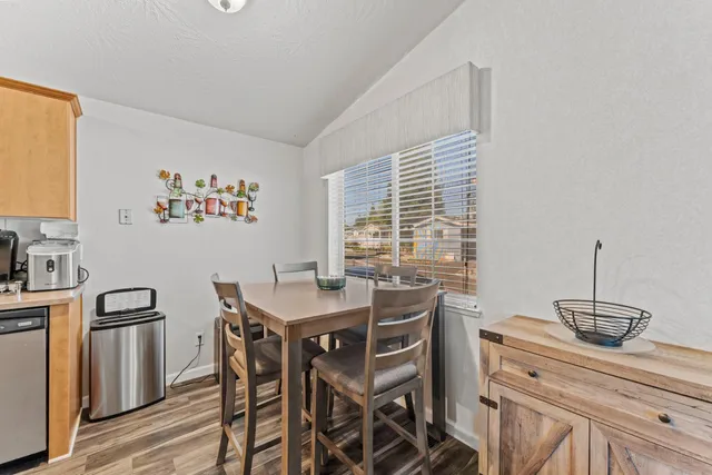 a view of a kitchen with a table and chairs