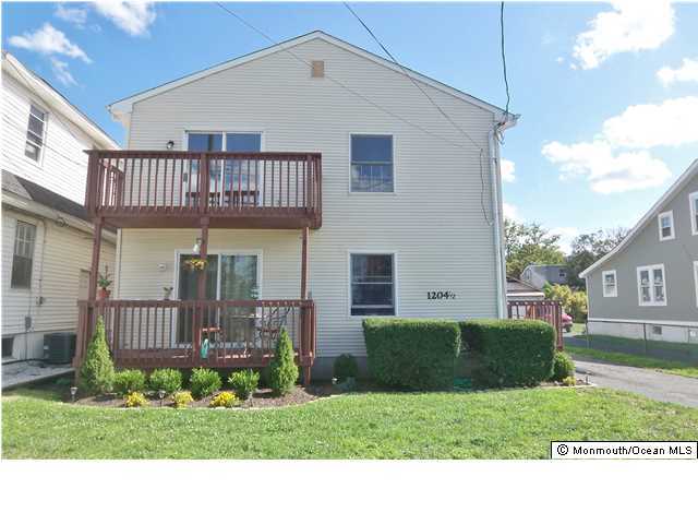 1204 River Road, Unit 1/2 B Belmar, NJ 07719 - Photo 1 of 19 a front view of a house with garden