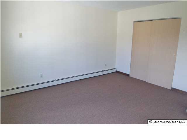 1204 River Road, Unit 1/2 B Belmar, NJ 07719 - Photo 16 of 19 a open area with wooden floor
