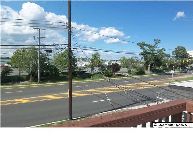 1204 River Road, Unit 1/2 B Belmar, NJ 07719 - Photo 18 of 19 a view of a swimming pool with a yard