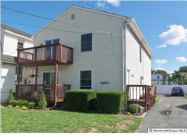 1204 River Road, Unit 1/2 B Belmar, NJ 07719 - Photo 2 of 19 a view of a house with a yard