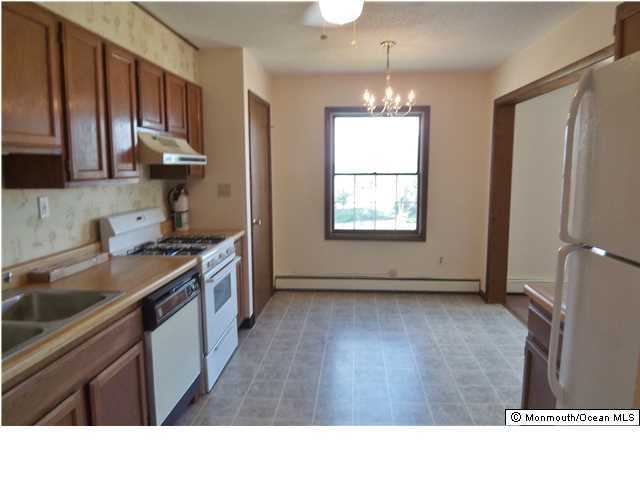 1204 River Road, Unit 1/2 B Belmar, NJ 07719 - Photo 3 of 19 a kitchen with stainless steel appliances granite countertop a sink stove and refrigerator