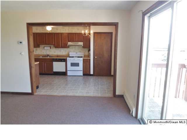 1204 River Road, Unit 1/2 B Belmar, NJ 07719 - Photo 7 of 19 a kitchen with a refrigerator and a sink
