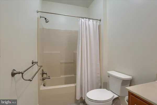 a bathroom with a toilet and shower