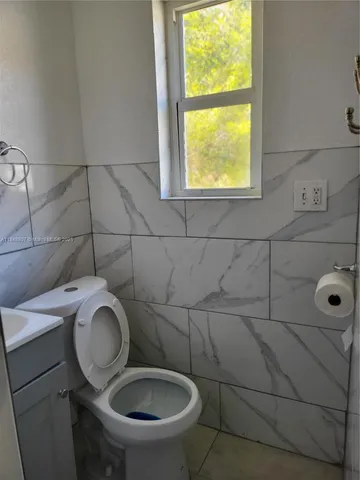 a bathroom with a toilet and a sink