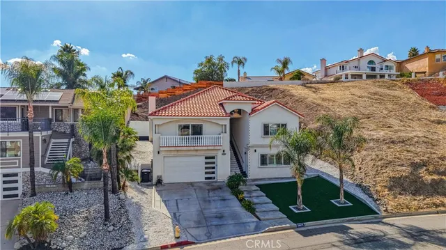 a aerial view of a house with a yard