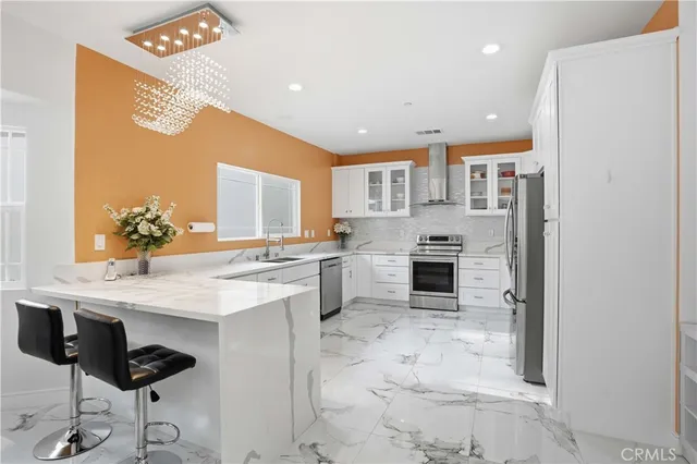 a spacious bathroom with a granite countertop sink and a mirror