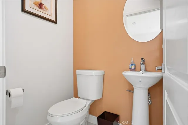 a view of a livingroom with workspace and a window