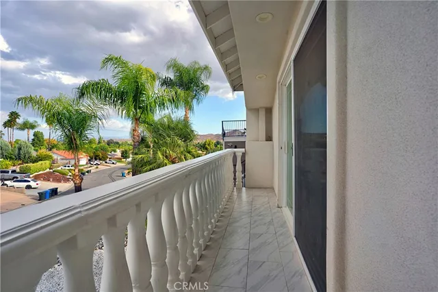 a living room with furniture and book shelf