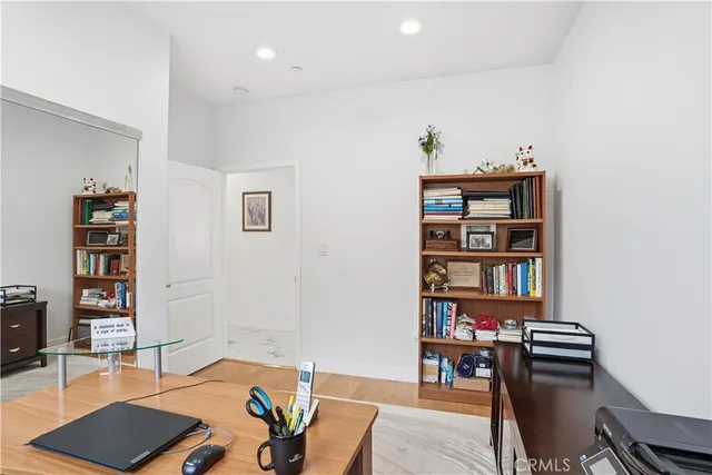 a bedroom with a bed and a couch