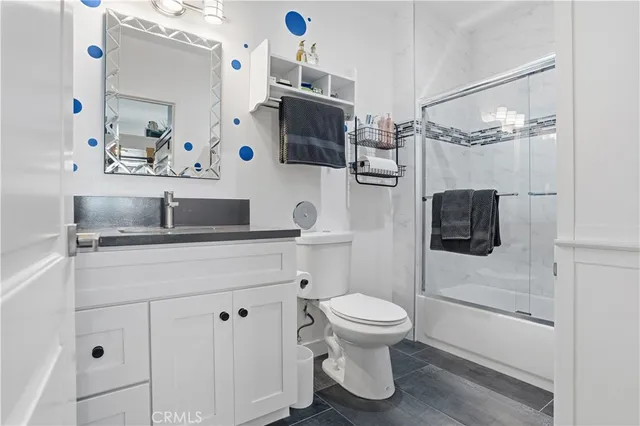a kitchen with a stove a table and chairs in it