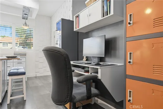 a large kitchen with stainless steel appliances kitchen island granite countertop a sink and cabinets