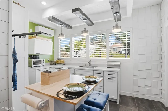 a outdoor living space with furniture and a fireplace