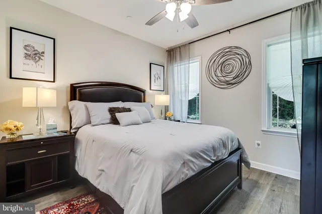 a bedroom with bed and a window