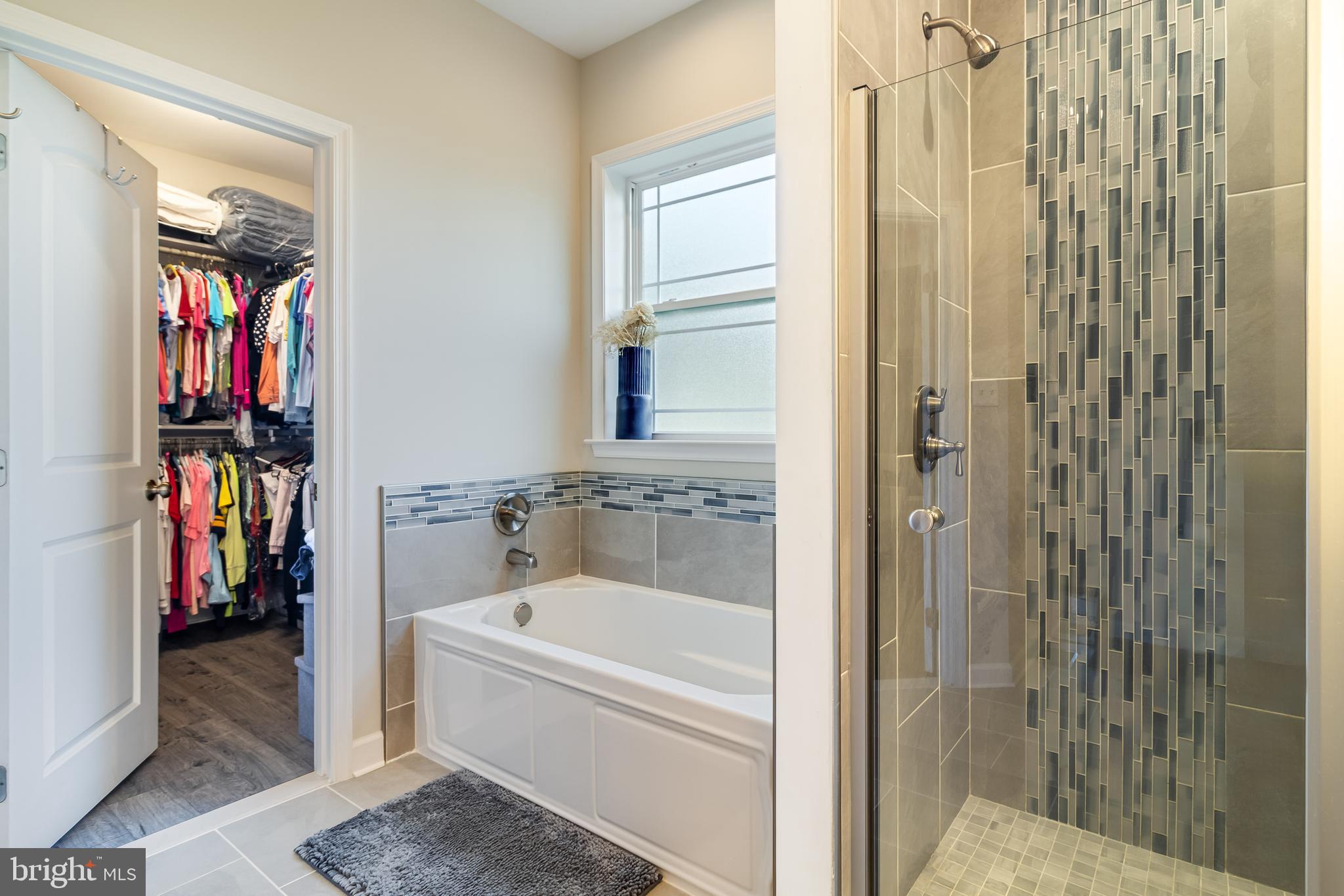 6925 Rock Spring Place Bryans Road, MD 20616 - Photo 21 of 32 a bathroom with a bathtub and a shower