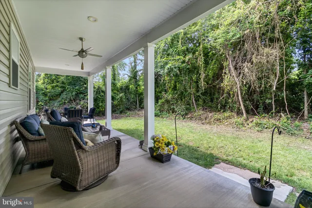 a view of a couches in backyard of house