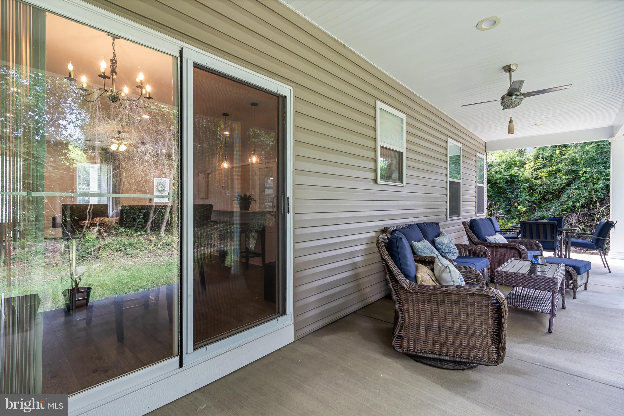 6925 Rock Spring Place Bryans Road, MD 20616 - Photo 28 of 32 a outdoor space with patio the couches and a dining table with garden view