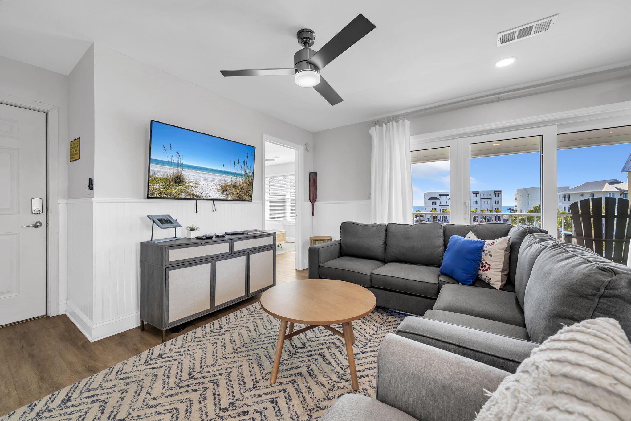 11 Beachside Drive, Unit 131 Santa Rosa Beach, FL 32459 - Photo 3 of 25 a living room with furniture and a flat screen tv