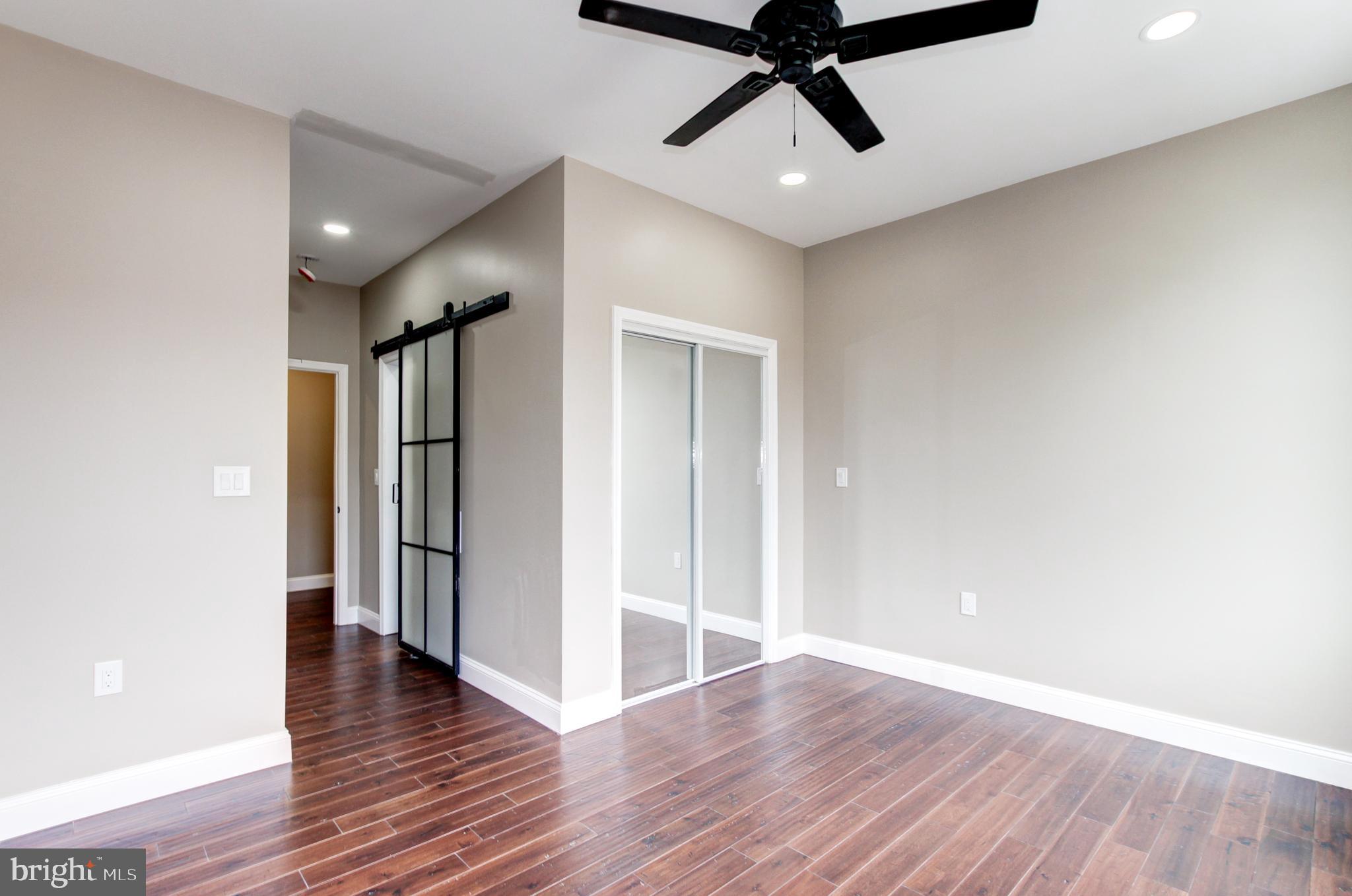 1324 Aisquith Street Baltimore, MD 21202 - Photo 14 of 47 a view of a room with wooden floor and white walls