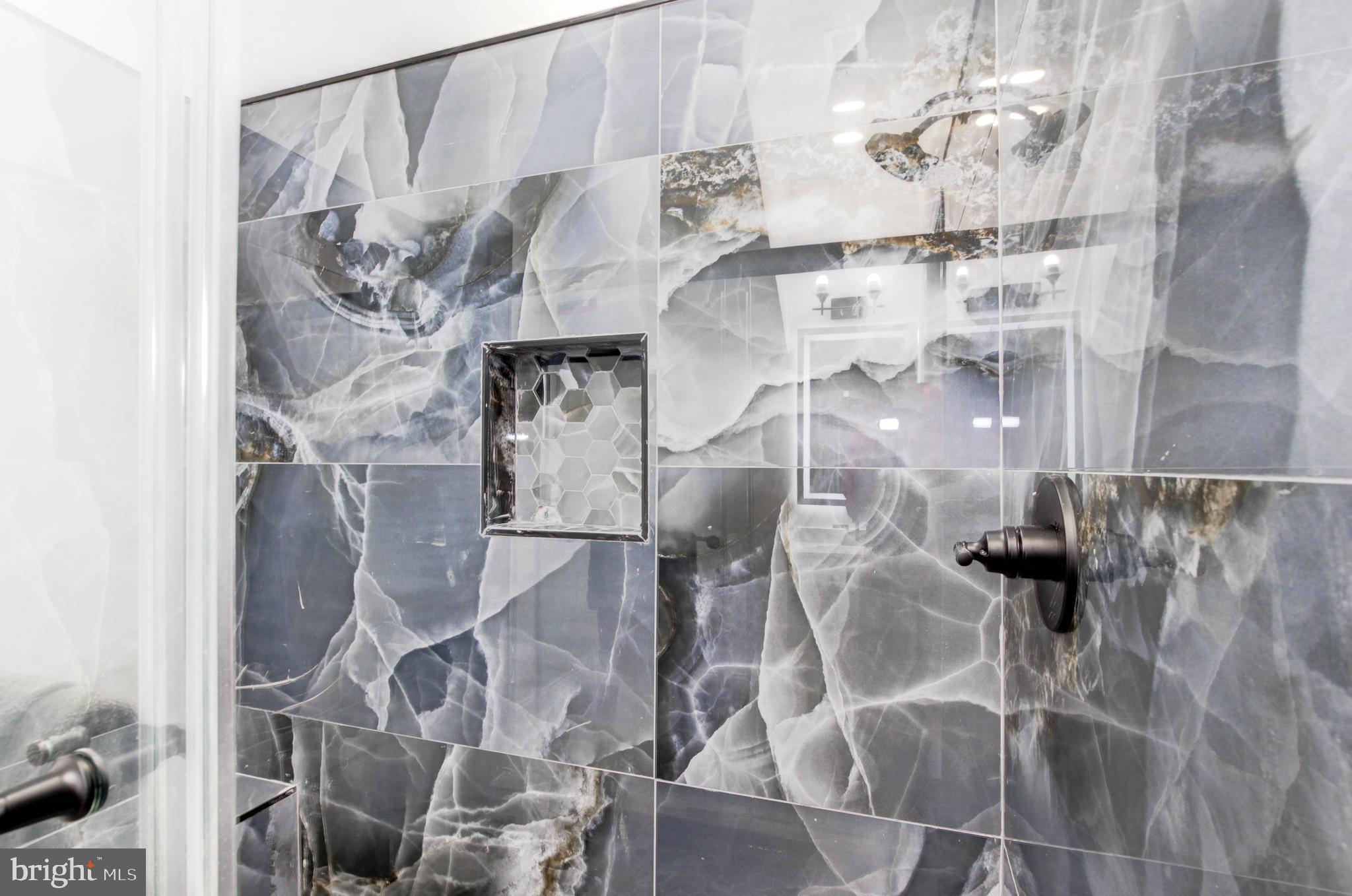 1324 Aisquith Street Baltimore, MD 21202 - Photo 16 of 47 a bathroom with a glass shower door and sink