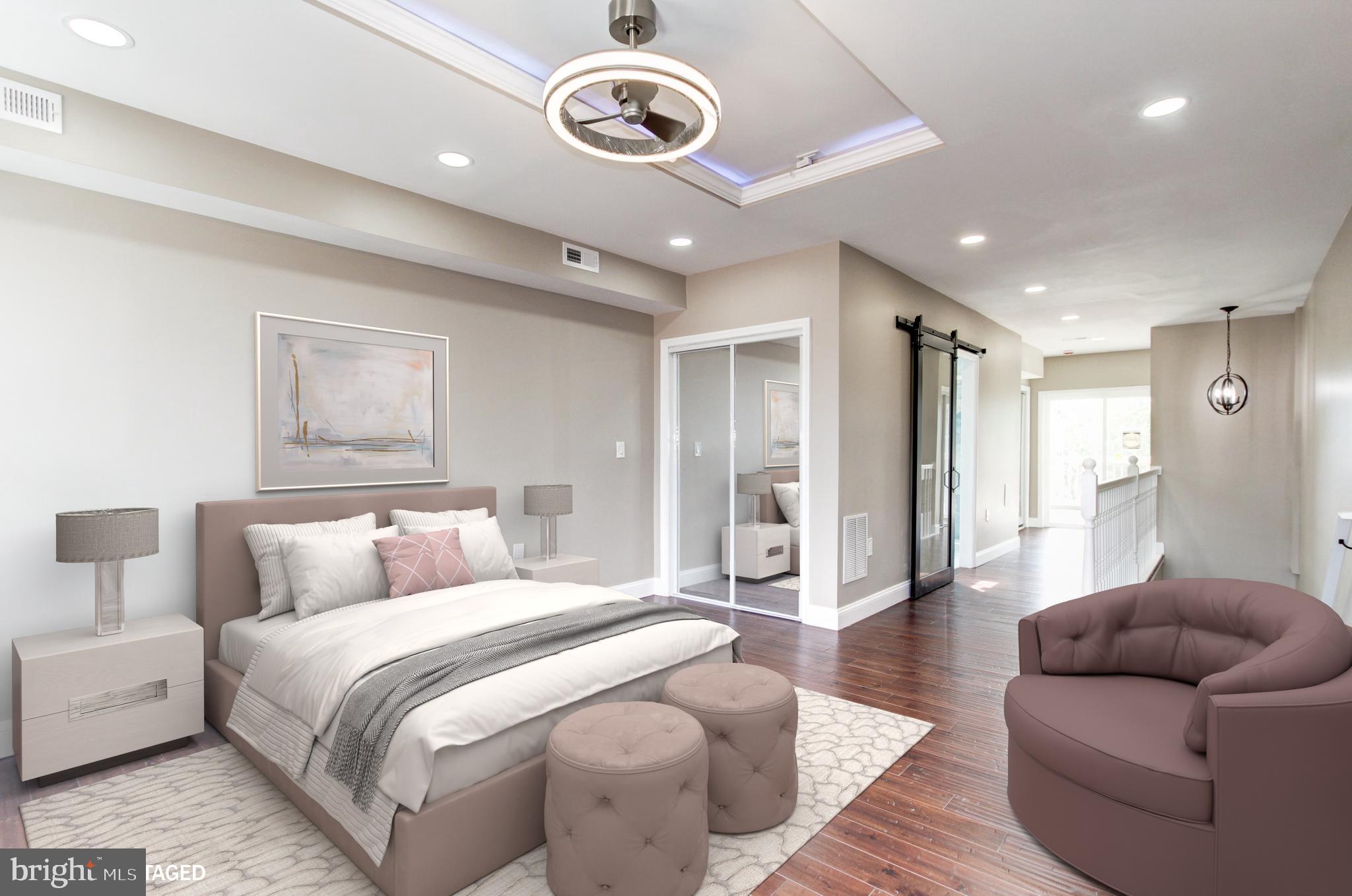 1324 Aisquith Street Baltimore, MD 21202 - Photo 24 of 47 a spacious bedroom with a bed couch and a window