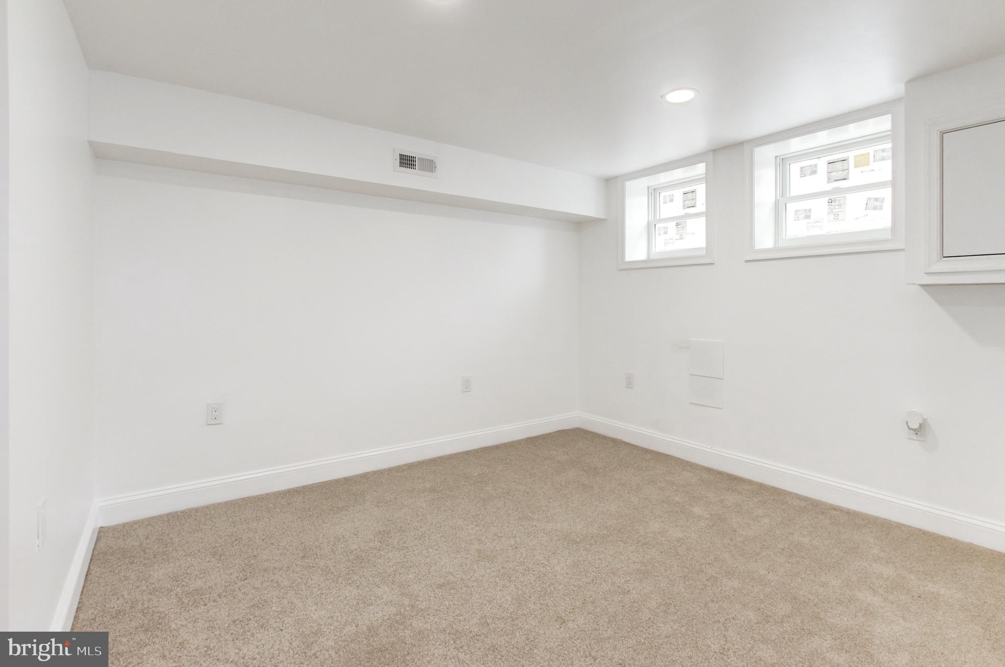 1324 Aisquith Street Baltimore, MD 21202 - Photo 35 of 47 an empty room with windows