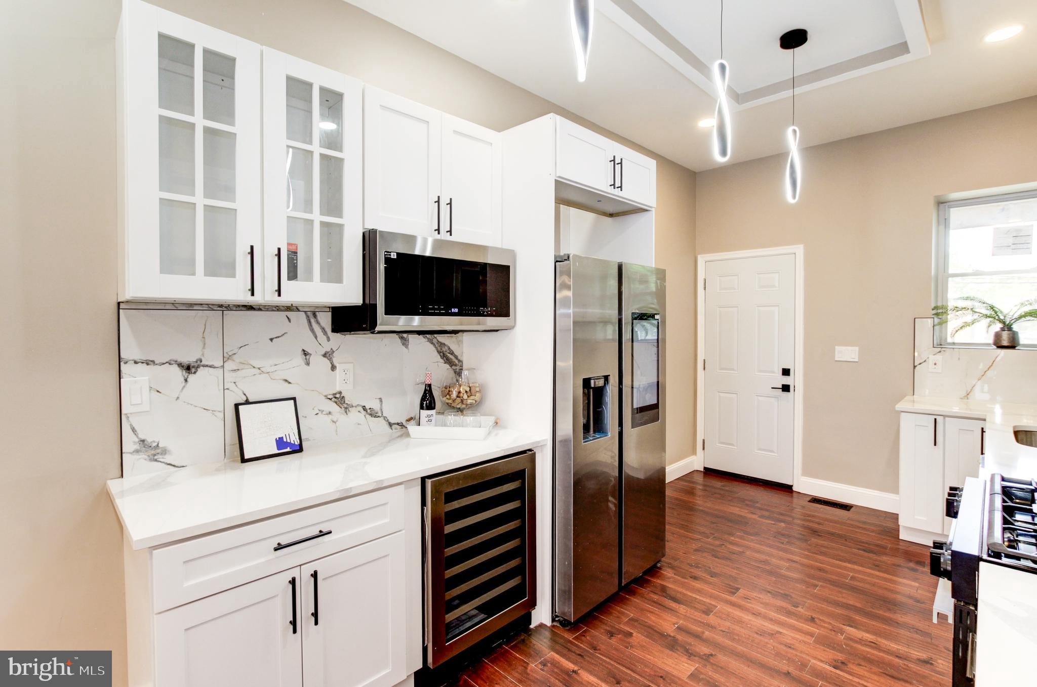 1324 Aisquith Street Baltimore, MD 21202 - Photo 4 of 47 a kitchen with a sink stove and refrigerator