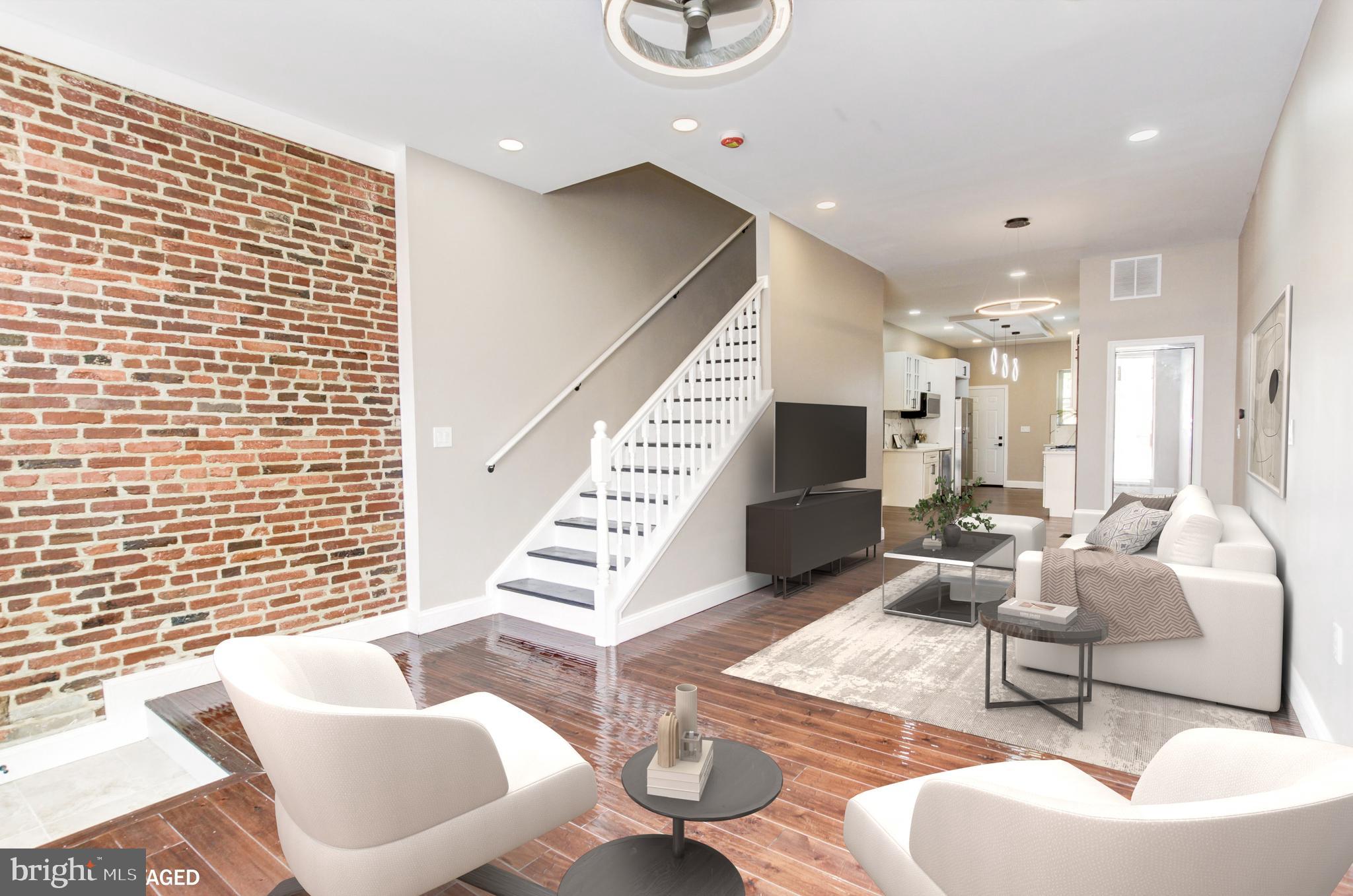 1324 Aisquith Street Baltimore, MD 21202 - Photo 6 of 47 a living room with furniture and a flat screen tv