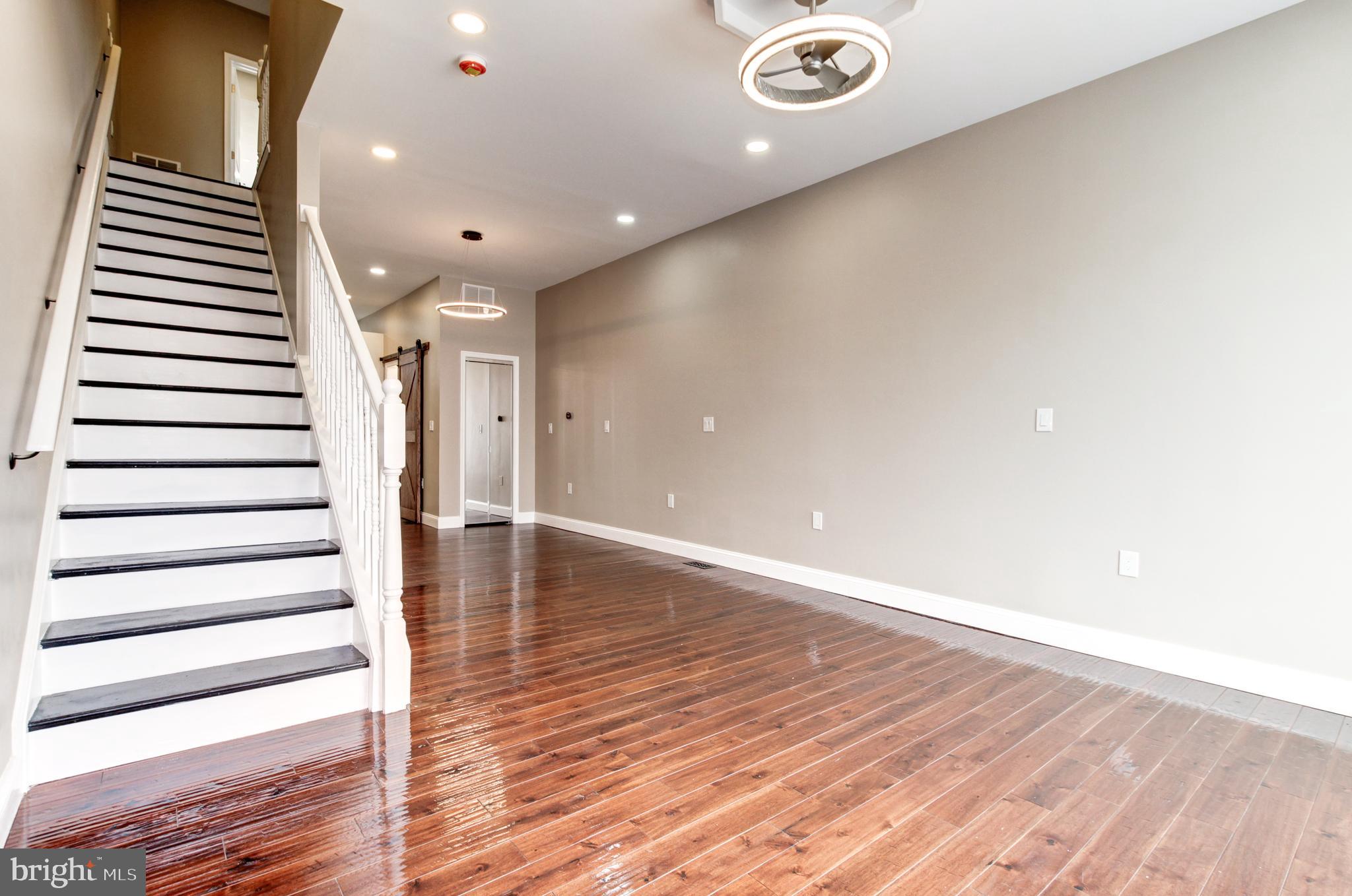 1324 Aisquith Street Baltimore, MD 21202 - Photo 8 of 47 a view of entryway with wooden floor