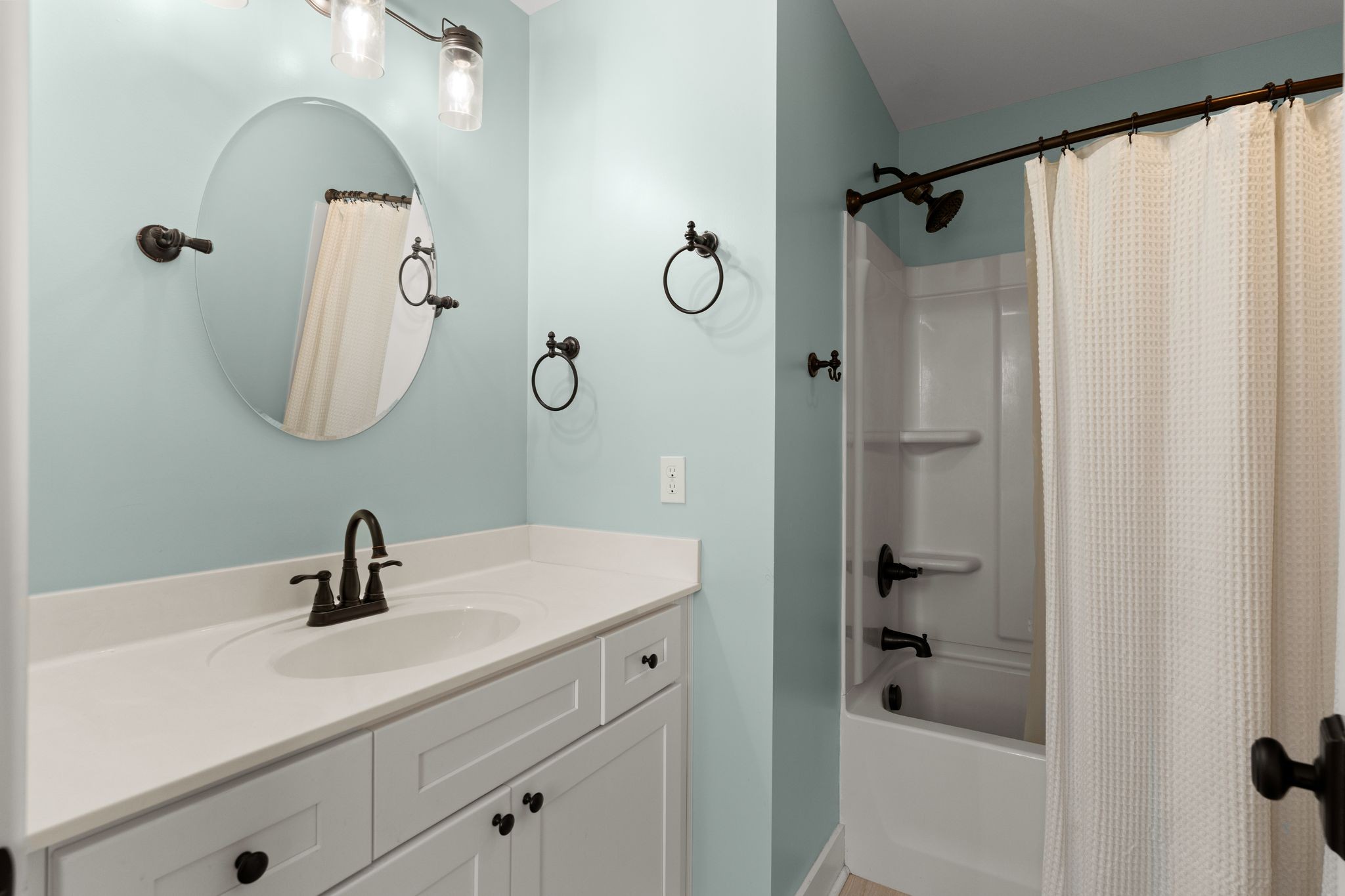 5216 Highway 161 Springfield, TN 37172 - Photo 22 of 31 a bathroom with a sink a glass door shower and mirror