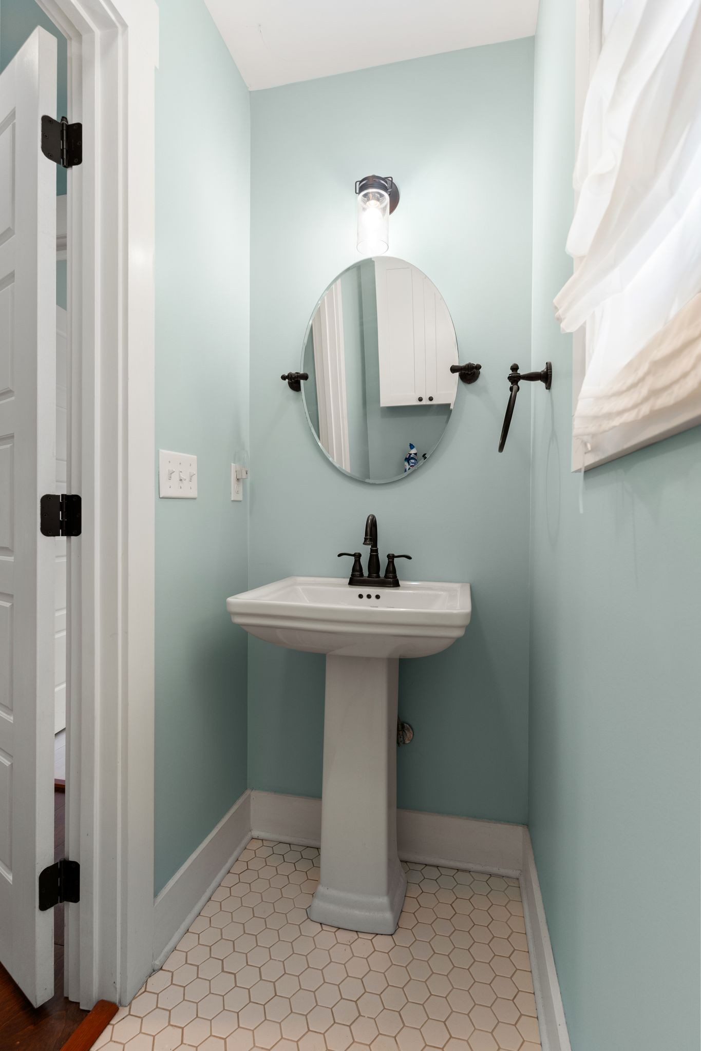 5216 Highway 161 Springfield, TN 37172 - Photo 23 of 31 a bathroom with a sink a mirror and shower view