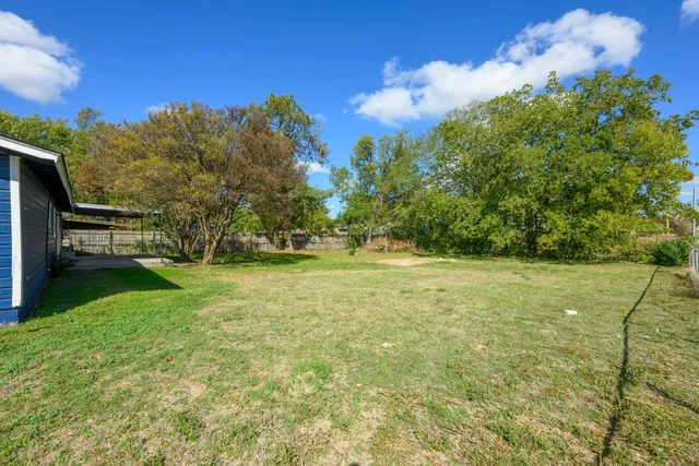 a view of outdoor space with deck and yard