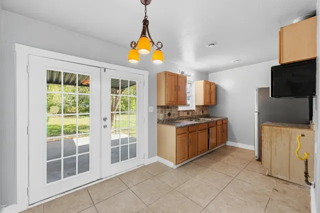 a view of a kitchen with a sink and a window