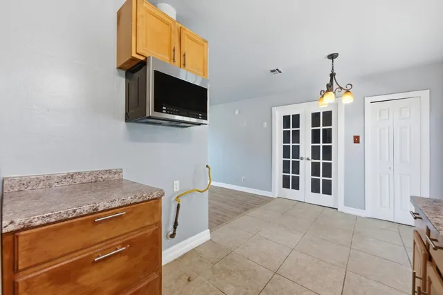 a kitchen with a stove and a microwave