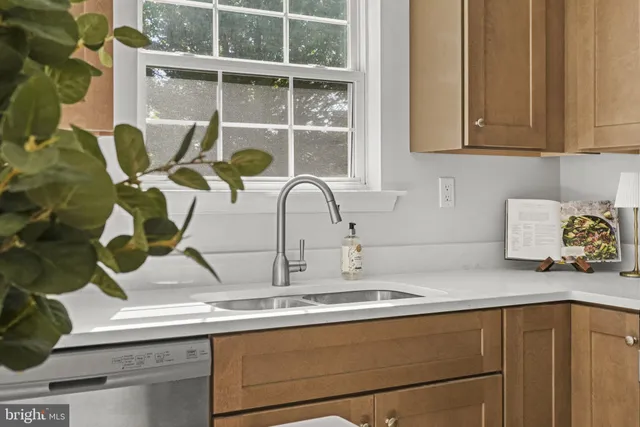 a kitchen with sink and window