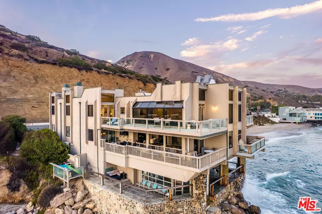 a view of a large building with a mountain