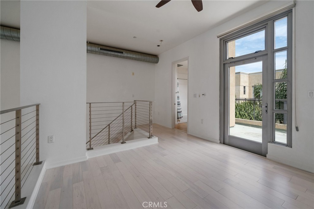 133 The, Unit 404 Long Beach, CA 90802 - Photo 13 of 25 a view of an empty room with glass door