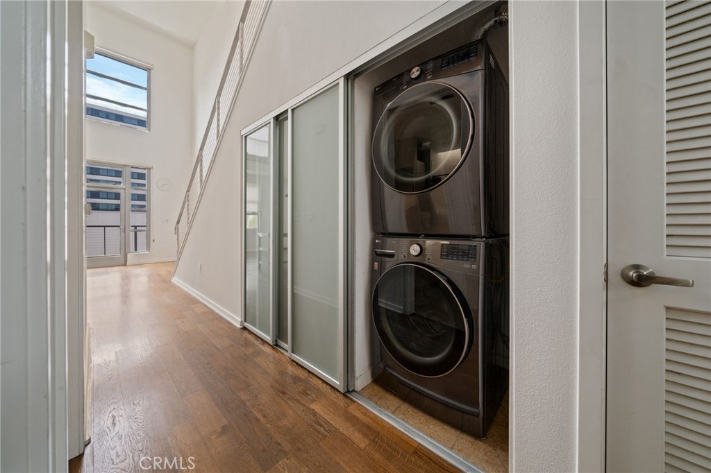 133 The, Unit 404 Long Beach, CA 90802 - Photo 6 of 25 a view of a hallway with washer and dryer