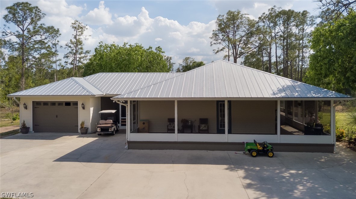 12421 Shawnee Road Fort Myers, FL 33913 - Photo 3 of 35 a front view of a house with a yard