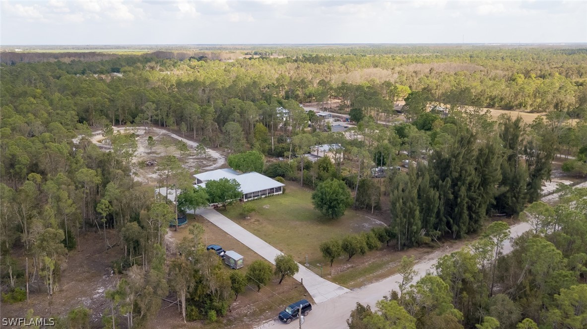 12421 Shawnee Road Fort Myers, FL 33913 - Photo 34 of 35 an aerial view of residential houses with outdoor space and trees