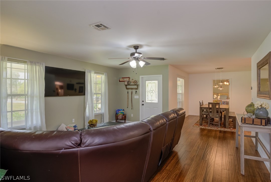 12421 Shawnee Road Fort Myers, FL 33913 - Photo 8 of 35 a living room with furniture and wooden floor