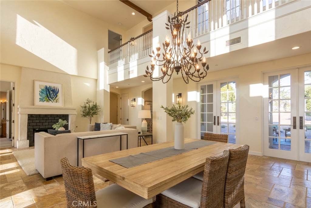 4567 Sleeping Indian Road Fallbrook, CA 92028 - Photo 12 of 72 a view of a dining room with furniture a chandelier and wooden floor
