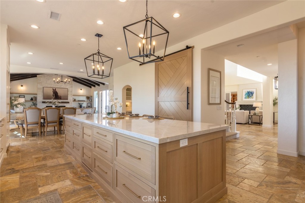 4567 Sleeping Indian Road Fallbrook, CA 92028 - Photo 13 of 72 a kitchen with cabinets and a view of living room