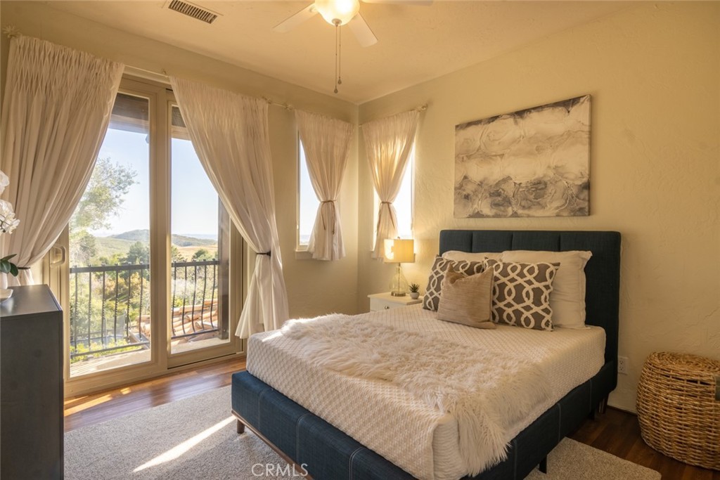4567 Sleeping Indian Road Fallbrook, CA 92028 - Photo 14 of 72 a bedroom with a large bed and a large window