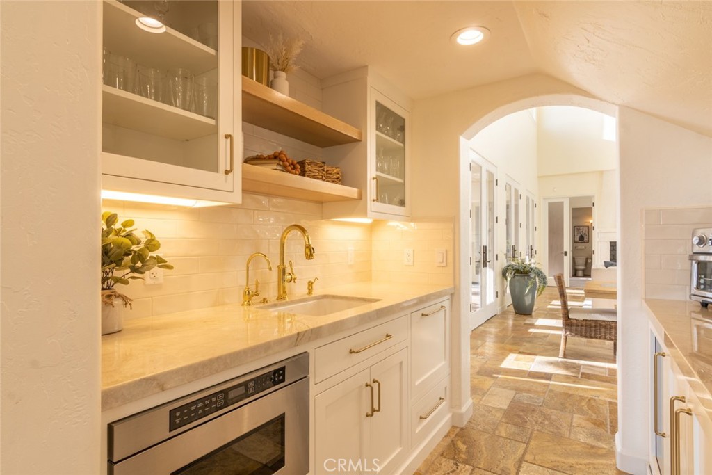 4567 Sleeping Indian Road Fallbrook, CA 92028 - Photo 15 of 72 a view of a kitchen with a sink and cabinets