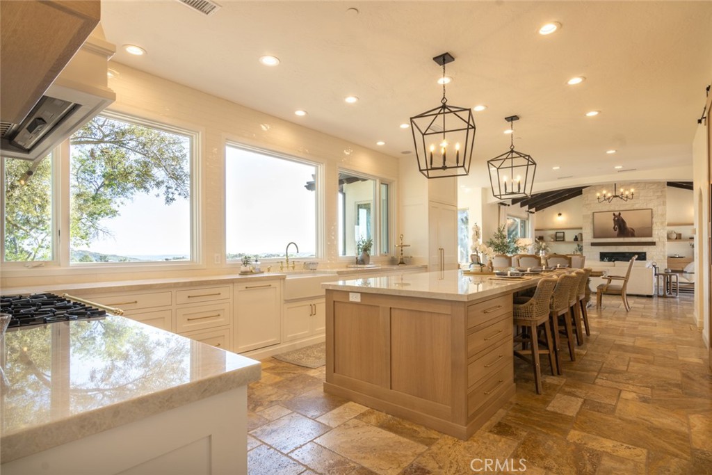 4567 Sleeping Indian Road Fallbrook, CA 92028 - Photo 22 of 72 a large kitchen with lots of counter top space and stainless steel appliances