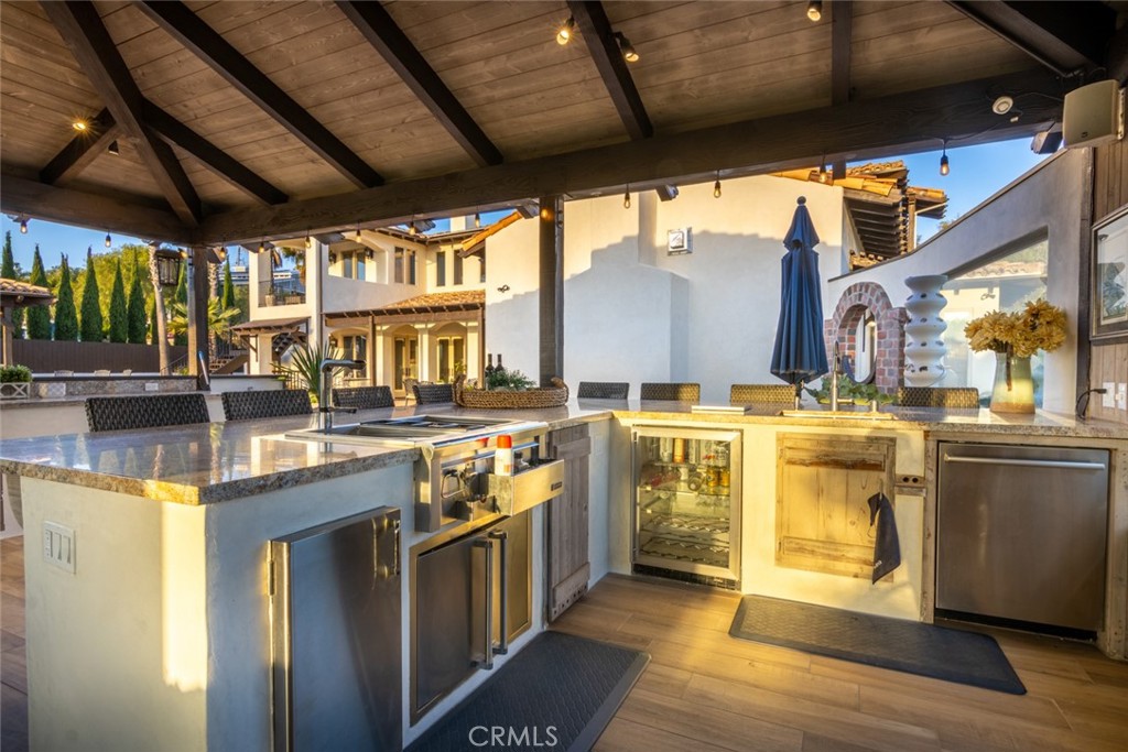 4567 Sleeping Indian Road Fallbrook, CA 92028 - Photo 30 of 72 a kitchen with stainless steel appliances granite countertop a sink and a stove