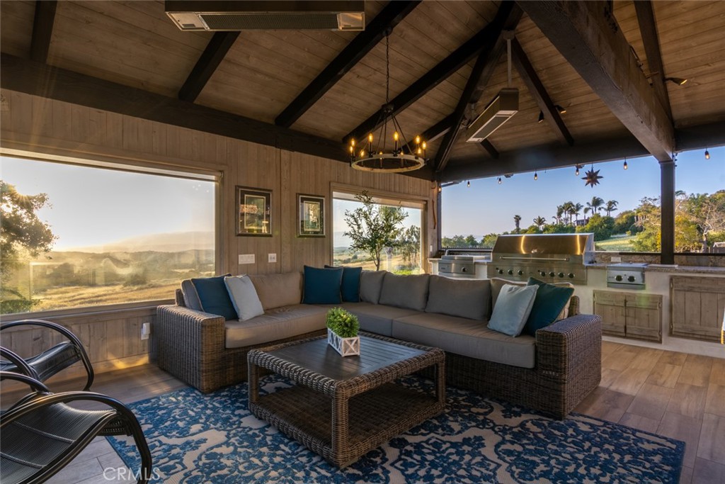 4567 Sleeping Indian Road Fallbrook, CA 92028 - Photo 31 of 72 a living room with furniture and a floor to ceiling window